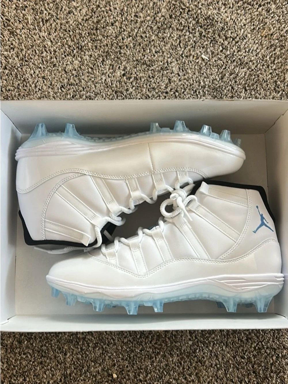 Jordan White Athletic Cleats with Light Blue Accents